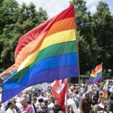 People take part in the Zurich Pride parade in Zurich, Switzerland, on Saturday, June 15, 2024. (KEYSTONE/Christian Beutler)